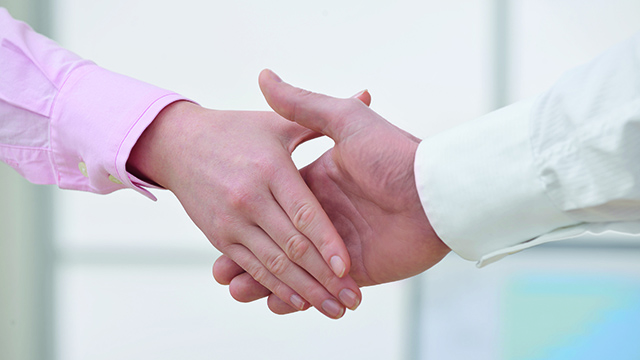 Handshaking as a symbol for cooperation.