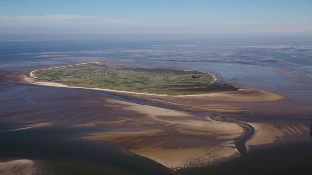A small island in the Wadden Sea from above.