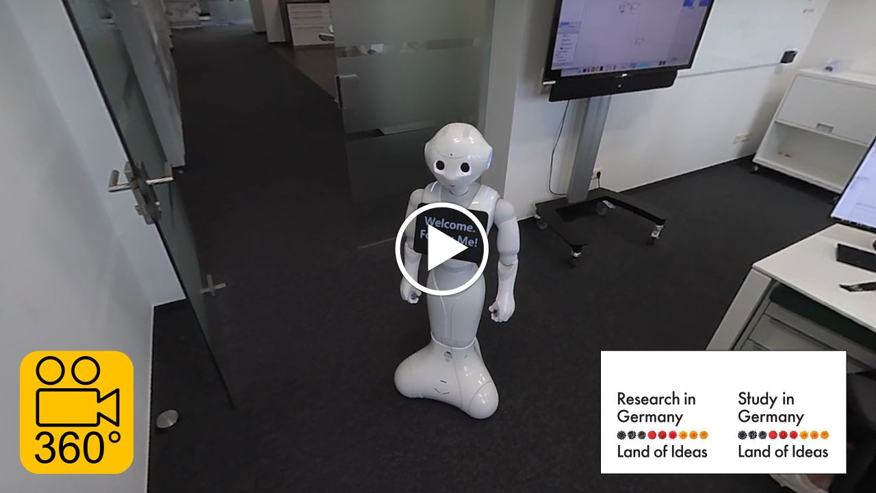 Robot Pepper standing in an office building