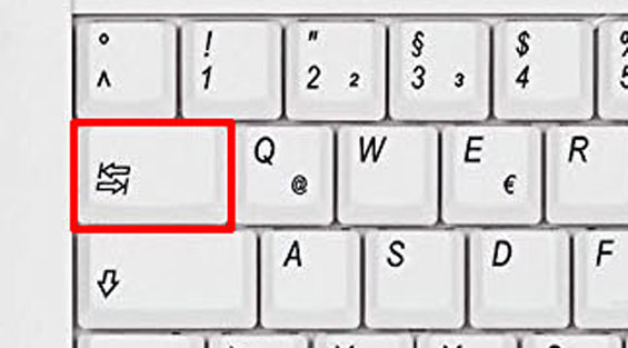 The tab key on a keyboard highlighted with a red frame.